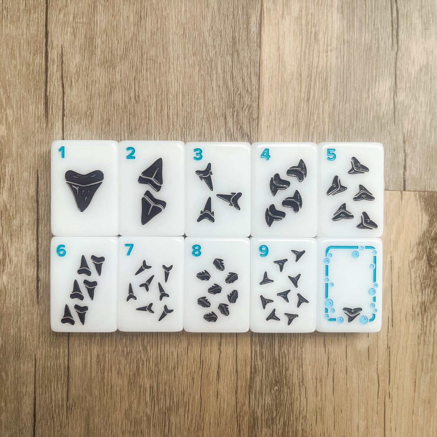 The Dot suit tiles 1-9 and the Soap Tile featuring sharks tooth designs