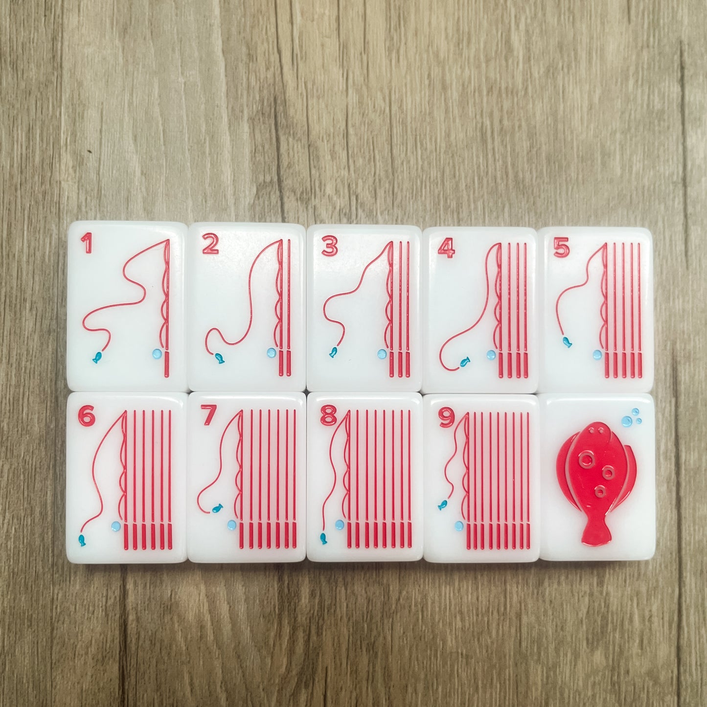 The Crak suit tiles 1-9 and the Flounder Red Dragon  featuring fishing pole design