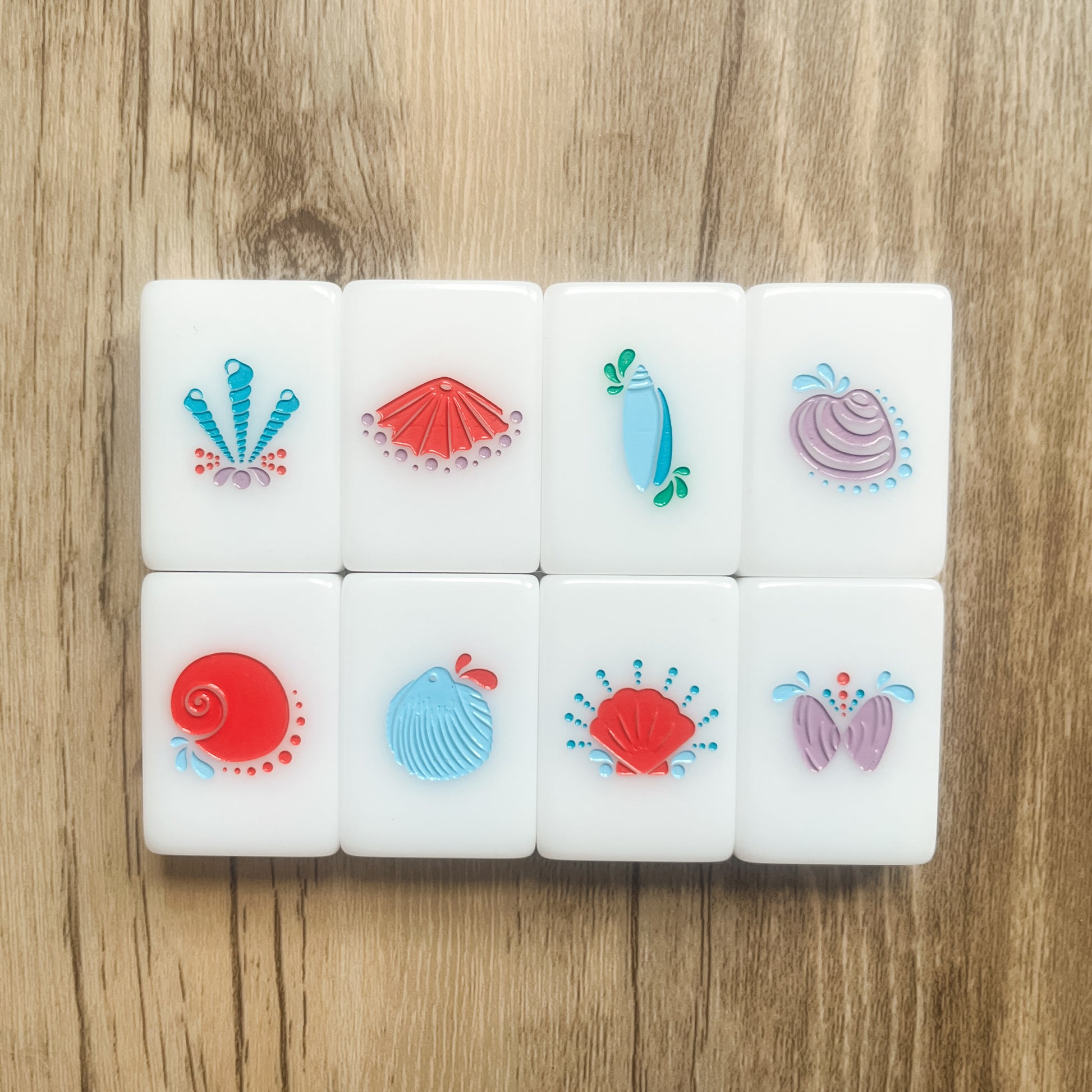 An image of all 8 flower tiles featuring shells found on Pawleys Beach